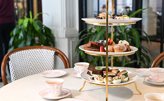 teacup, saucer, and spoon on a table
